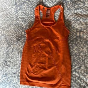 Gymshark burnt orange. No tags but new. Never worn